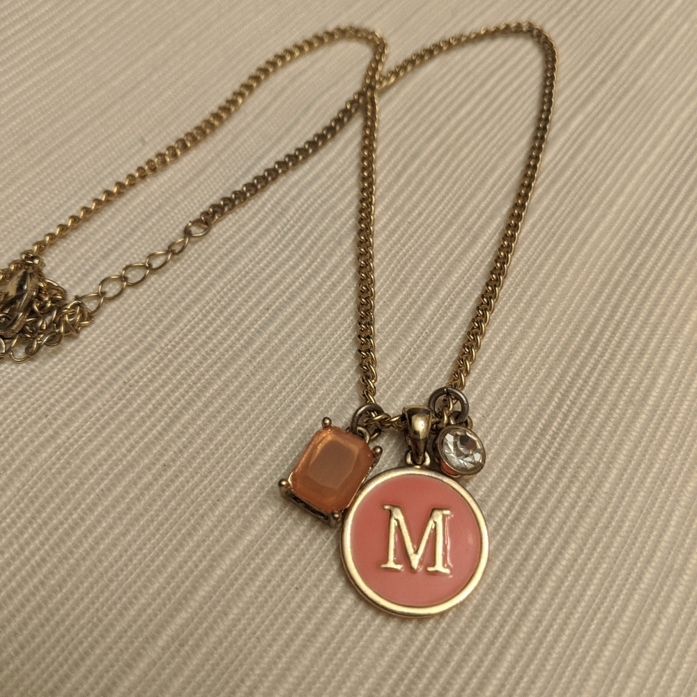 M gold and pink necklace with charms